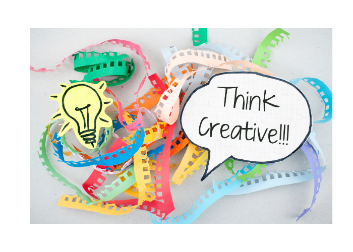 Think Creative thought bubble with colourful paper