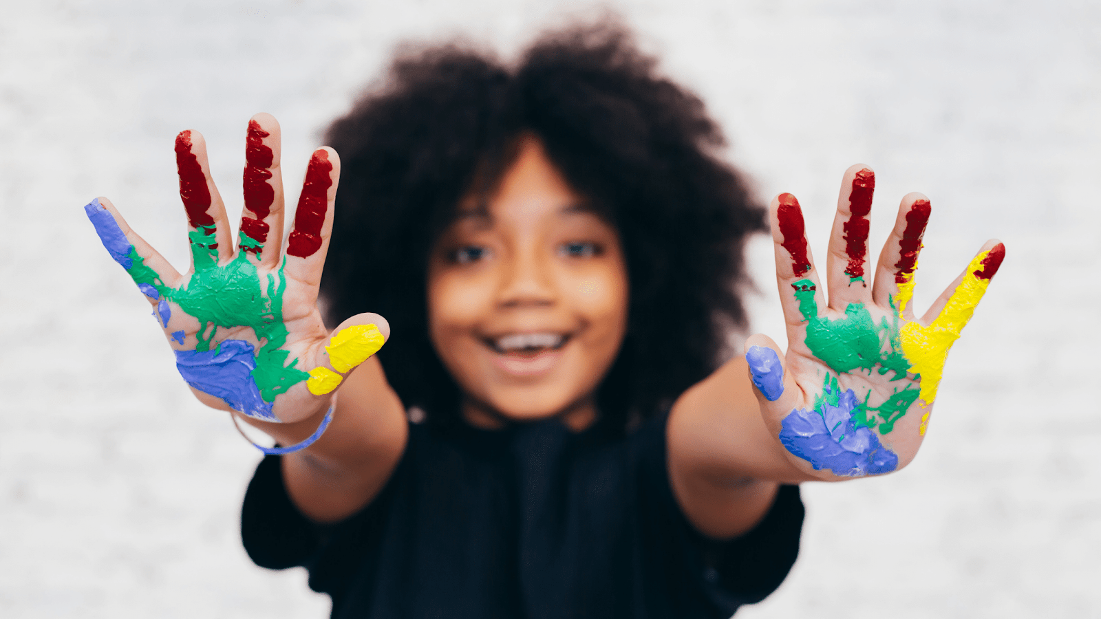 Smiling Kid with Paint on his hands