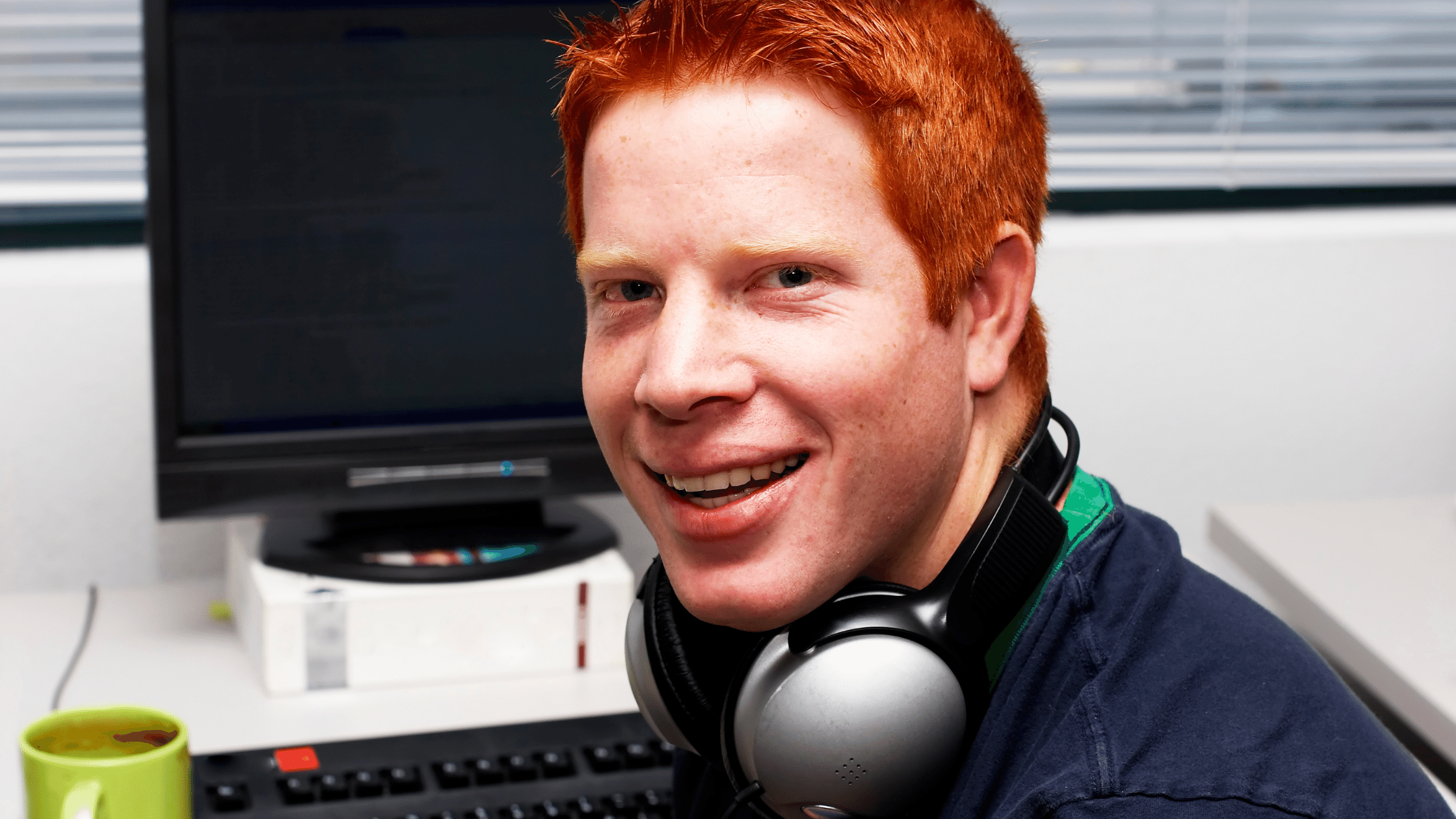 Programmer smiling at computer